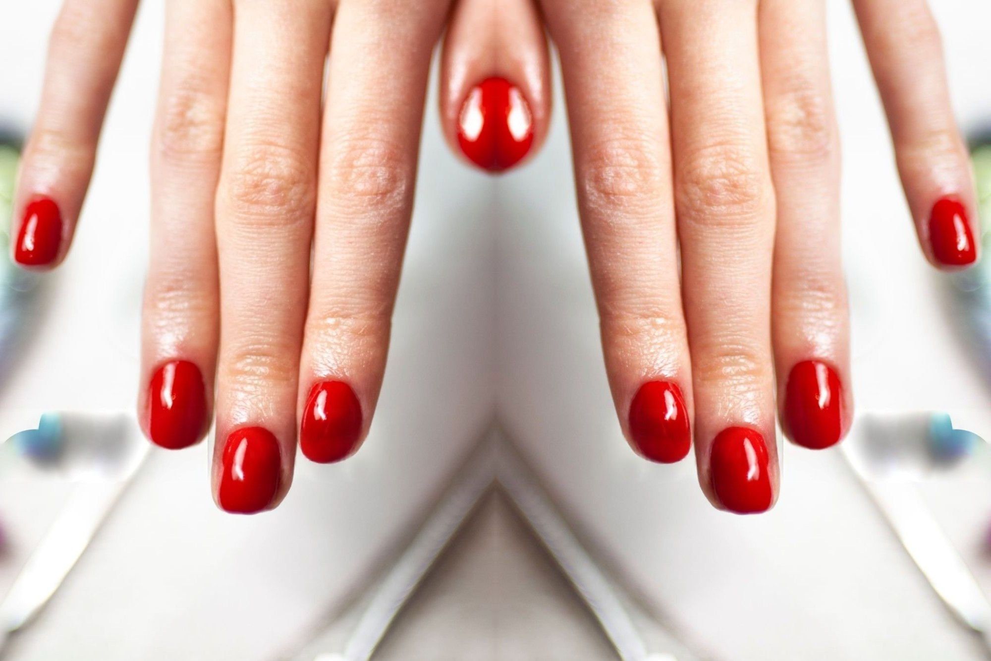 After a gel manicure: short rounded nails in glossy classic red