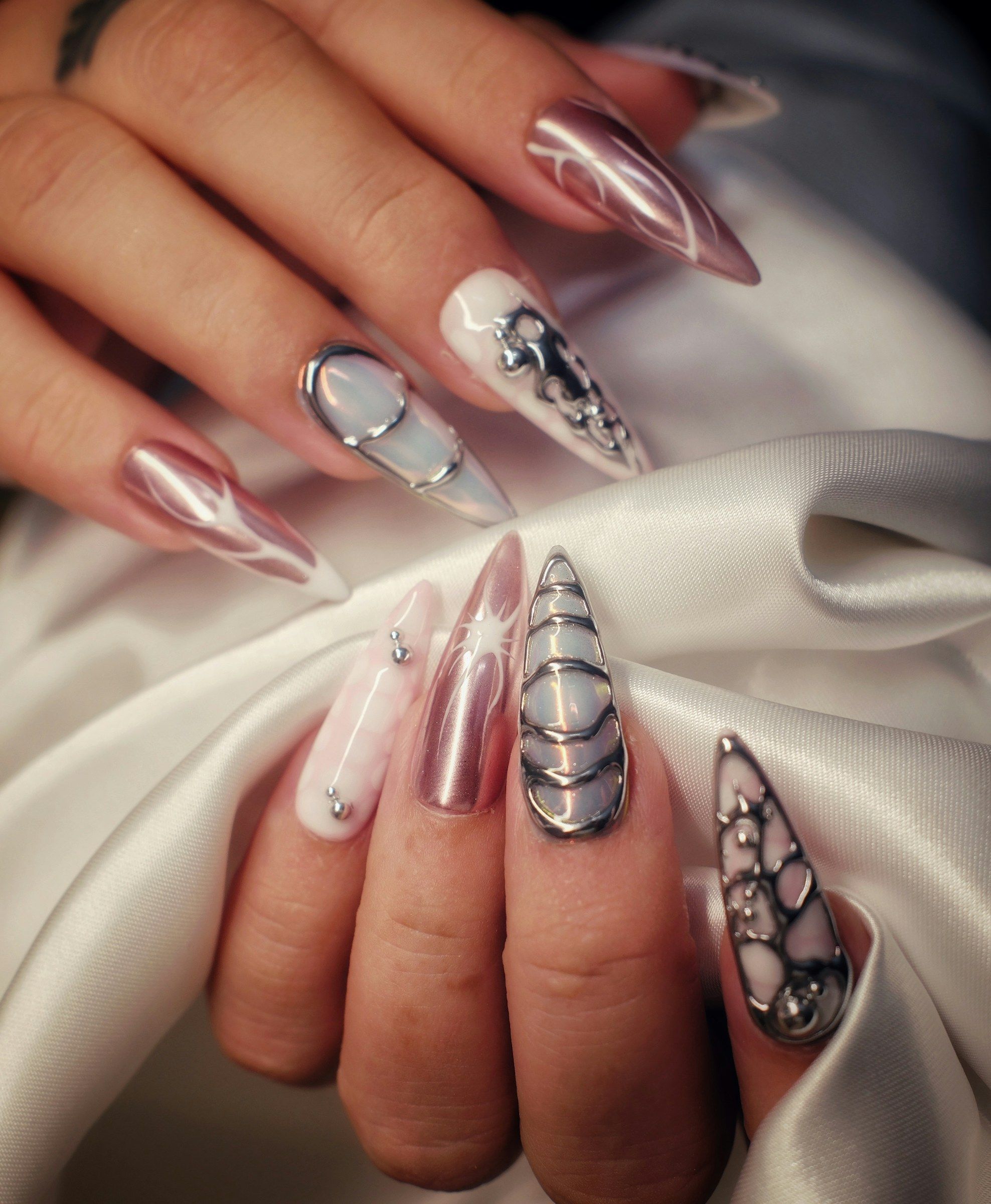 Chrome powder over gel, hand-sculpted cage lines and crystals